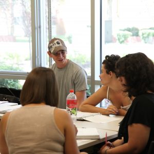 picture of people talking in Calderon aspen classroom