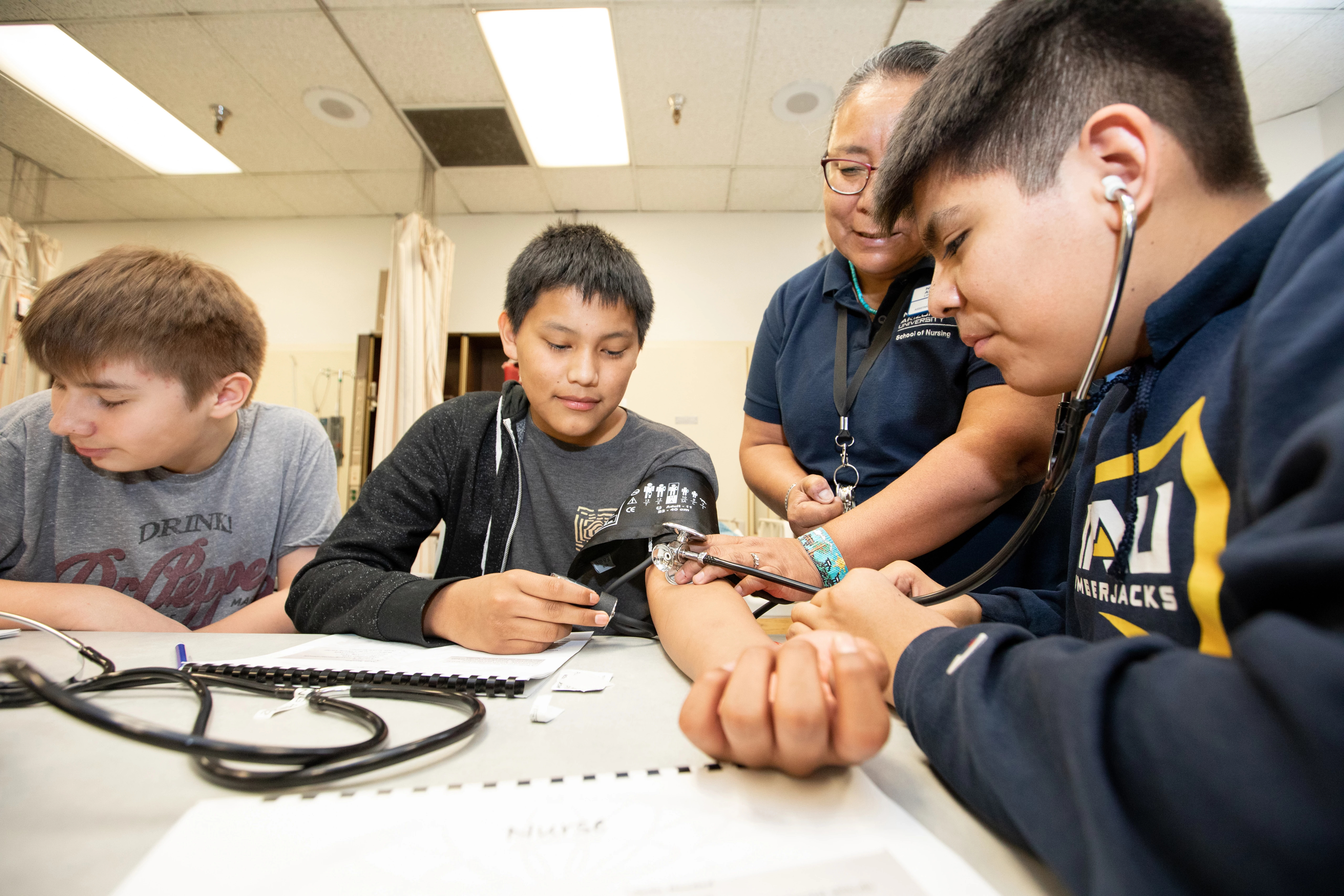 N A U nurses providing check-ups and training in indigenous communities.