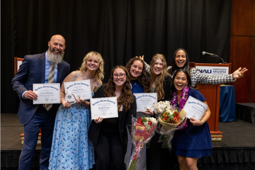 The Gold Axe Winners pose with their awards.
