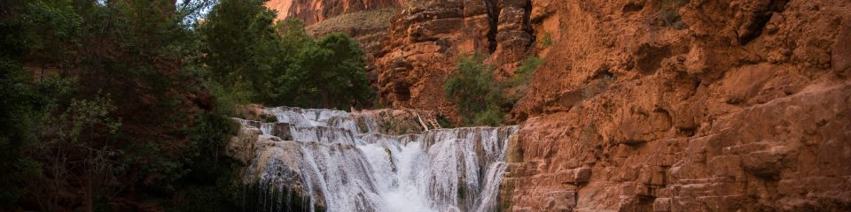 nau students study geochemistry near a waterfall