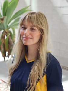 Britt Neal smiling at camera