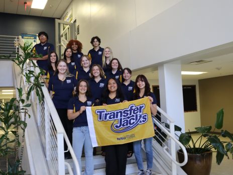 Transfer Mentors on Stairs Holding Flag