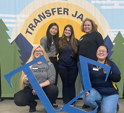 Five Tau Sigma leaders smiling at camera