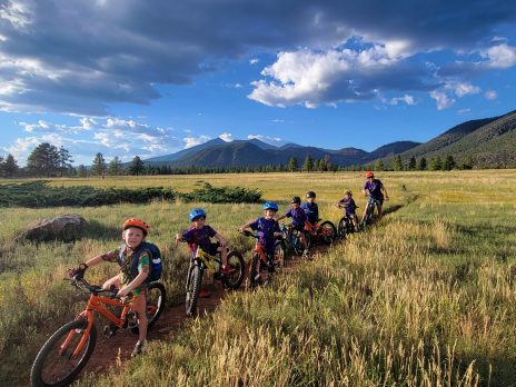Youth riders biking in on a trail in scenic Flagstaff, Arizona.