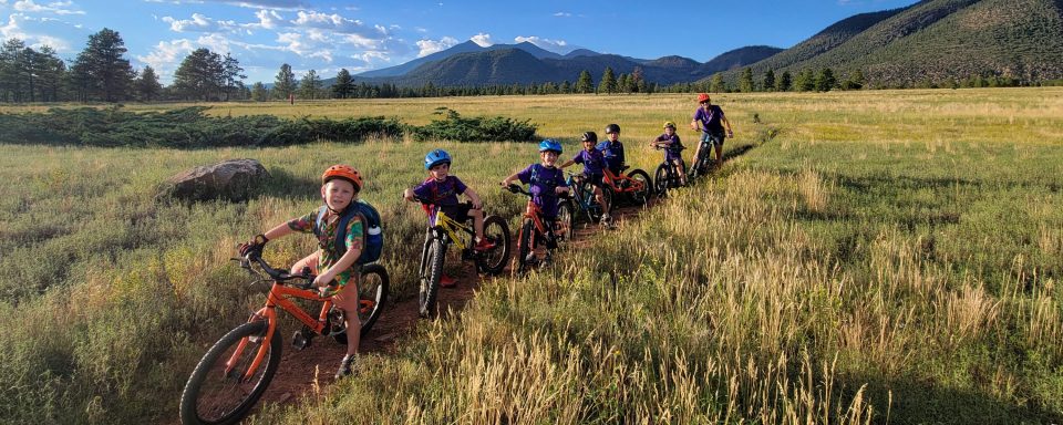 Youth riders biking in on a trail in scenic Flagstaff, Arizona.
