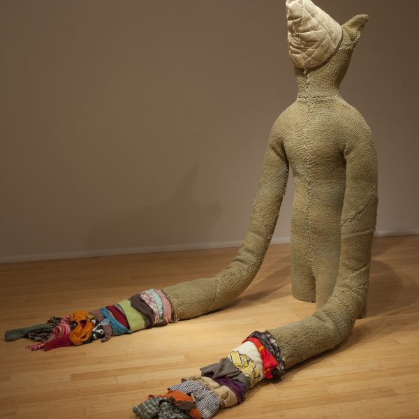 A soft sculpture, anamorphic in form made from handwoven fabric, steel, zippers