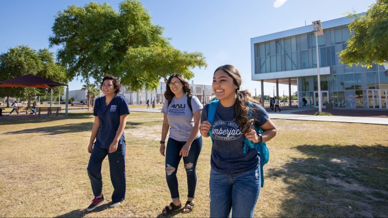 N A U–Yuma students walking on campus.