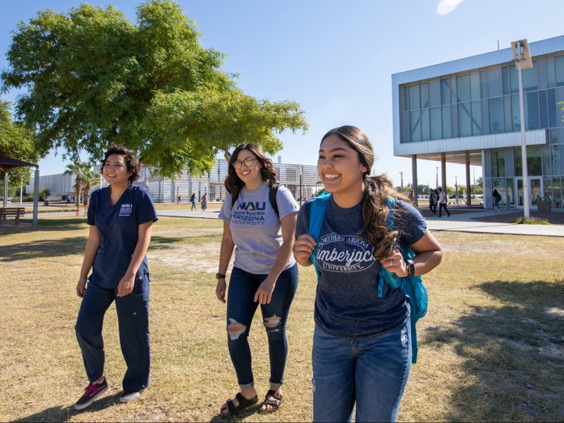 N A U–Yuma students walking on campus.