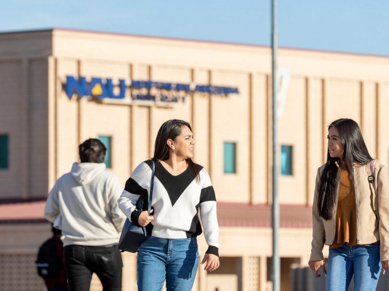 N A U–Yuma students walking on campus.