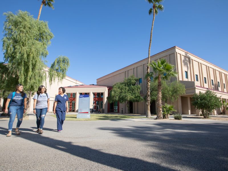 N A U–Yuma students walking on campus.