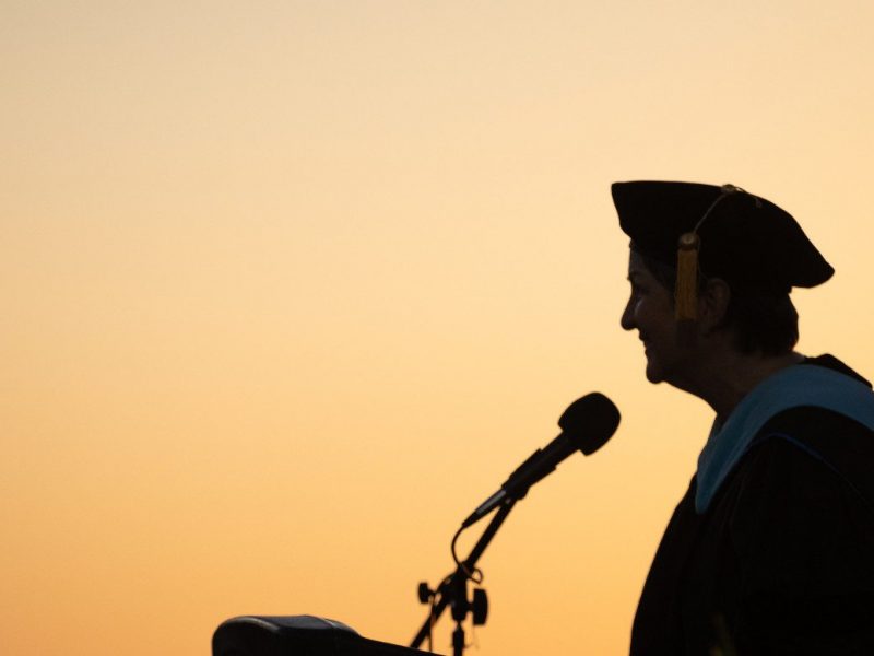Person speaking at Yuma commencement.