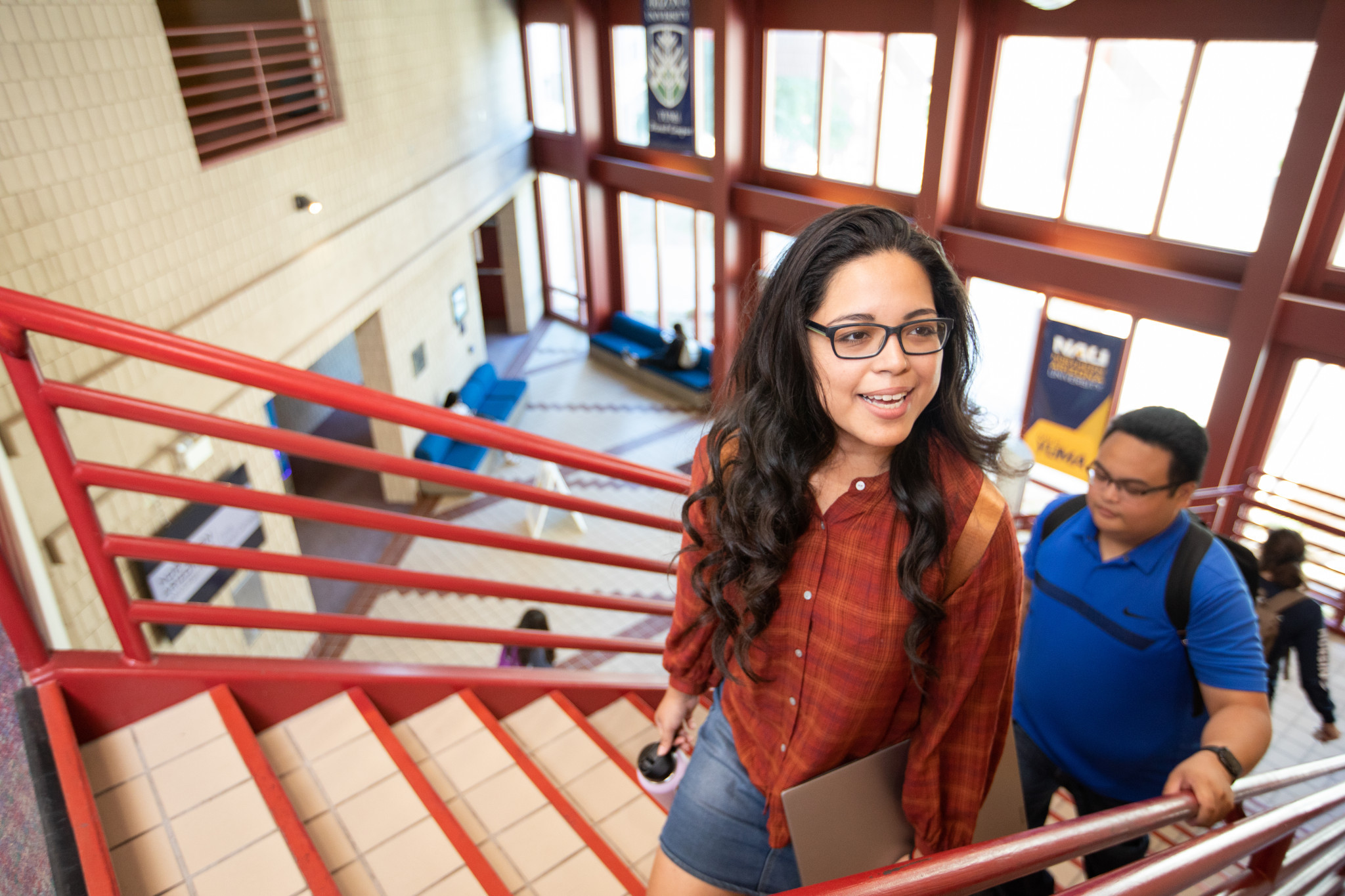 N A U–Yuma students walking up the stairs.