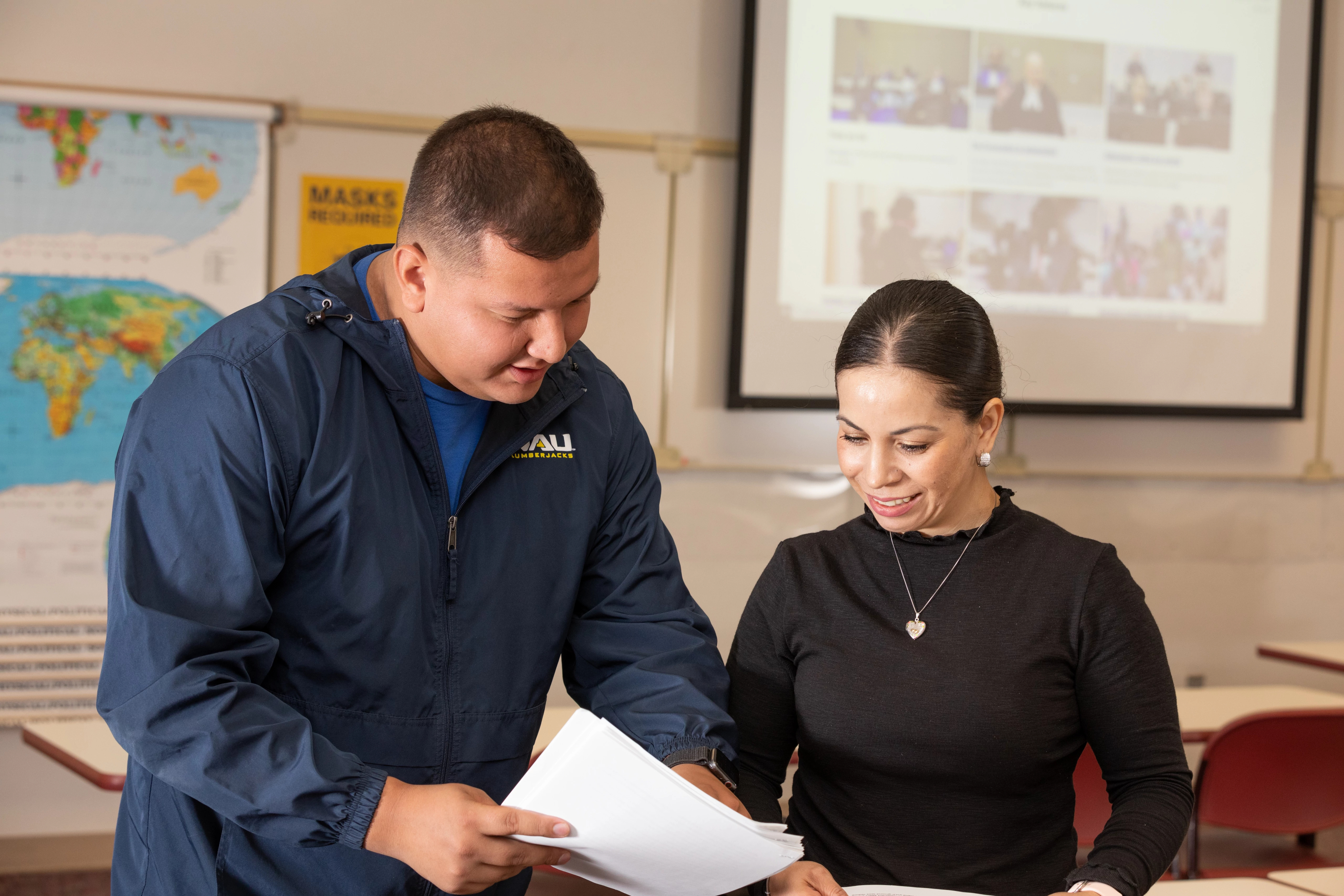 N A U–Yuma students consulting each other in class.