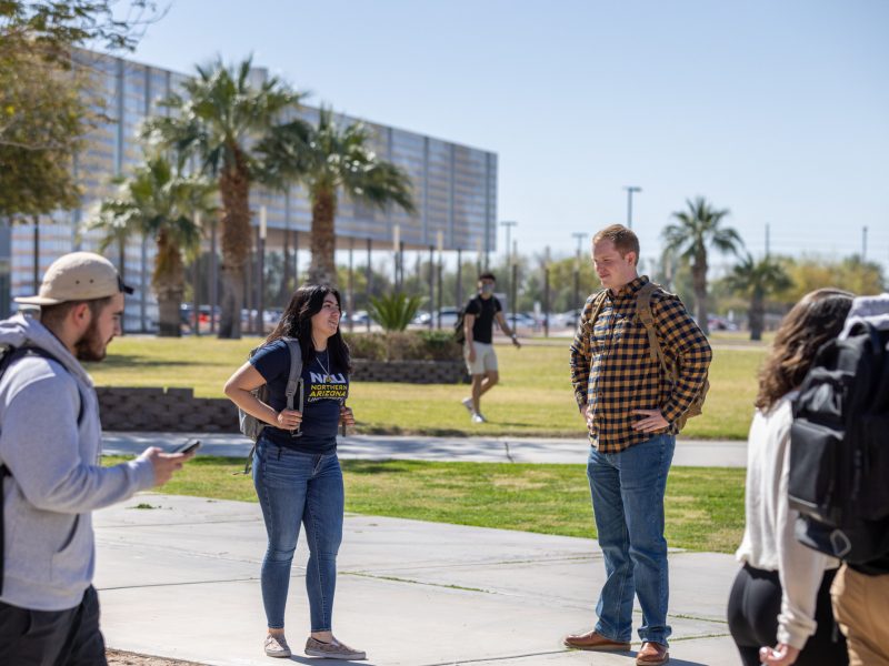 Group of students outside on N A U–Yuma campus.
