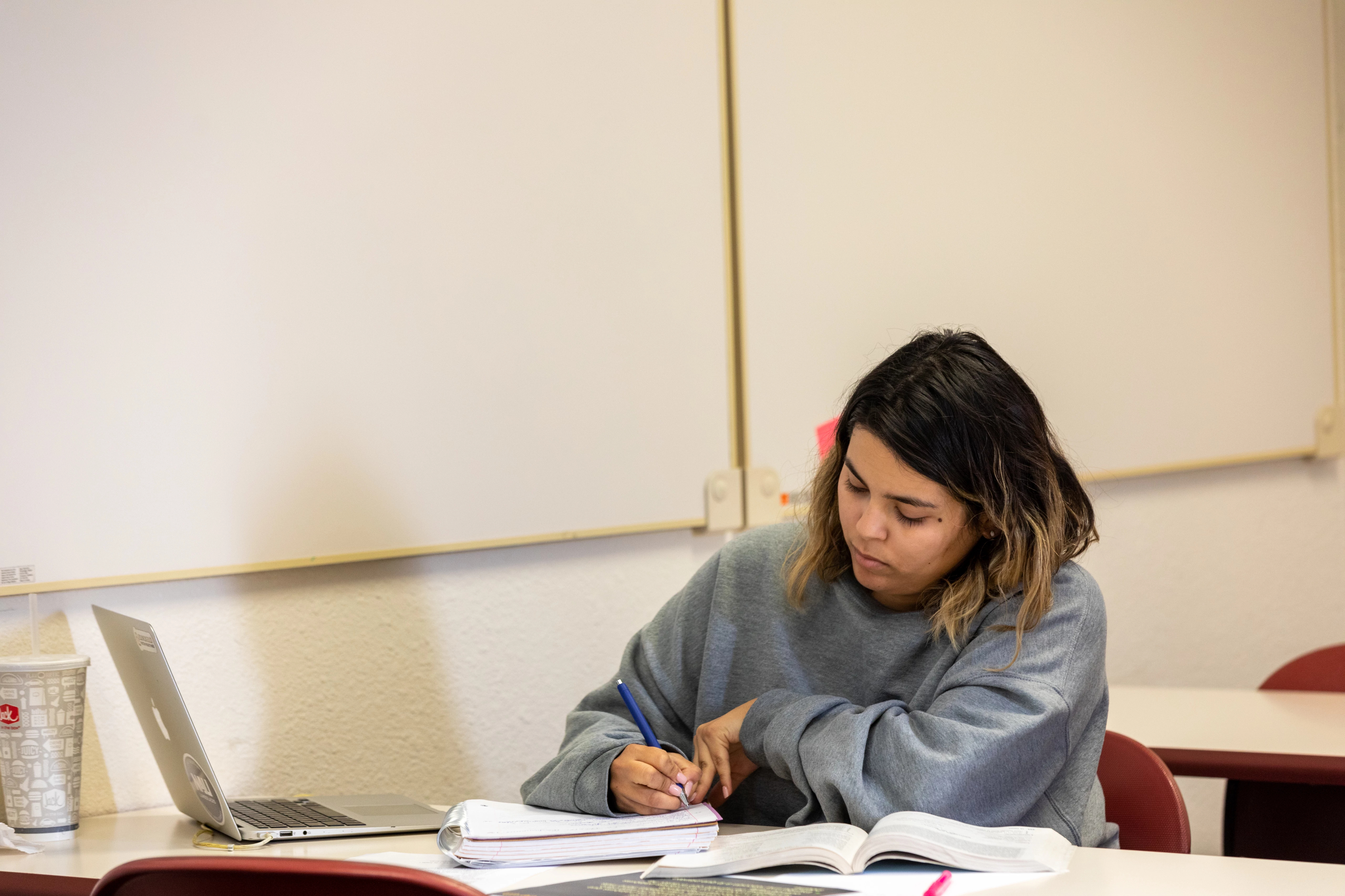 A student studying in a N A U–Yuma classroom.