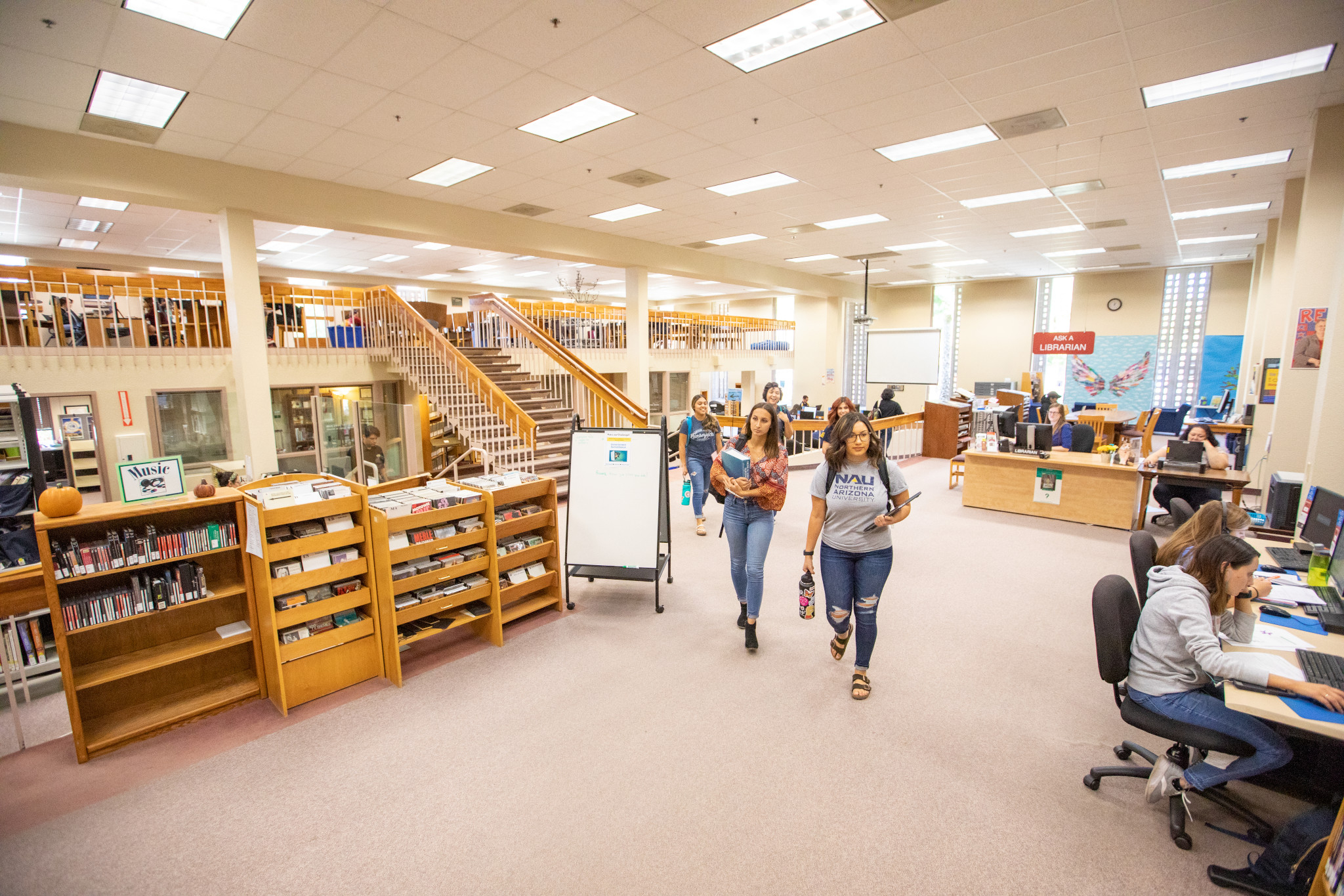 Students walking in the library at N A U–Yuma.