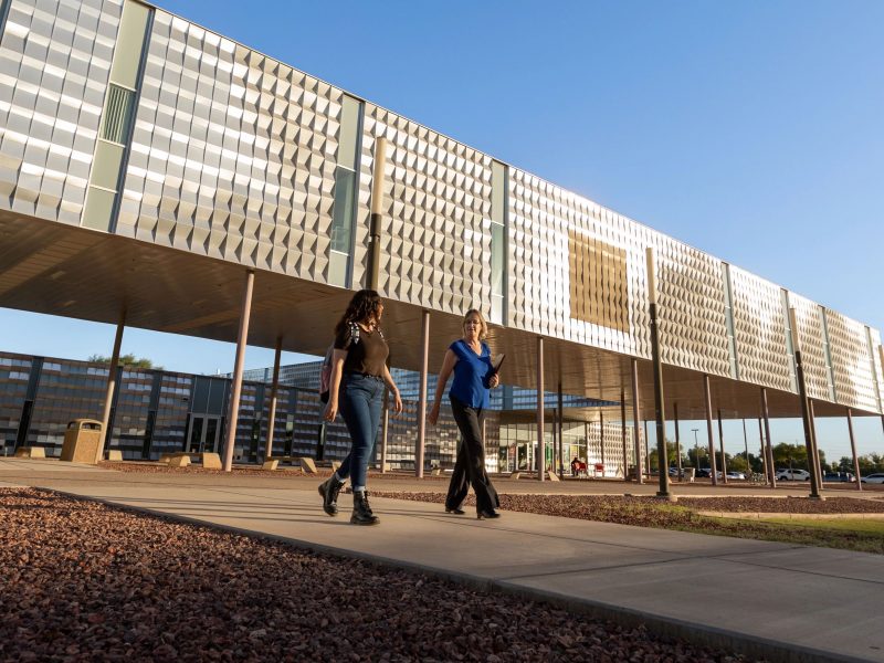 N A U–Yuma faculty walking on campus.