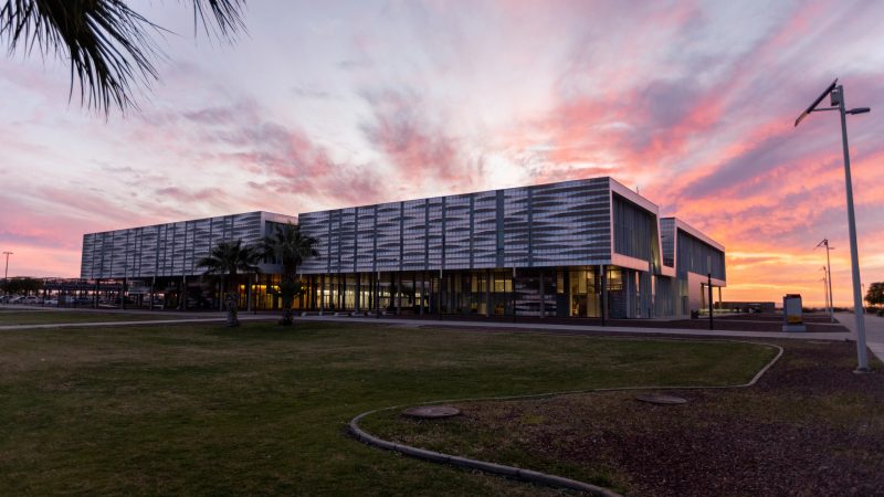 A N A U–Yuma building with the sunset in the background.