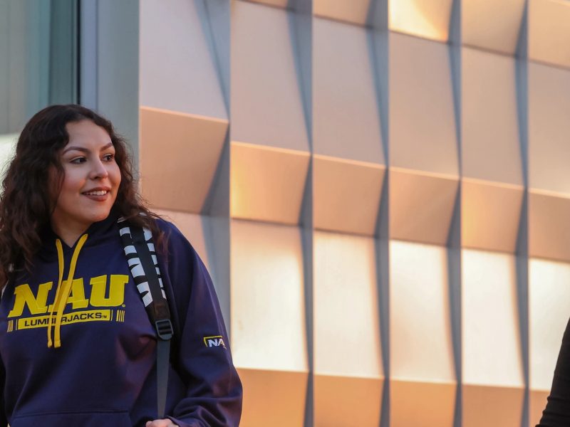 Students walking and talking on the N A U–Yuma campus.