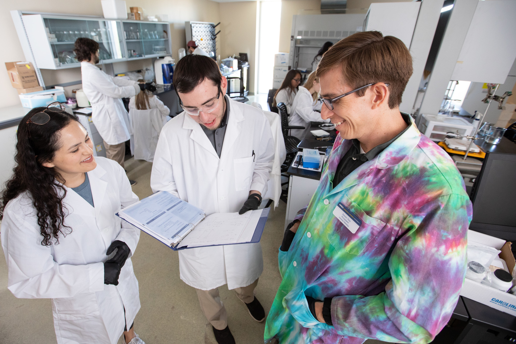 Students working with their professor in a N A U–Yuma genetics class.