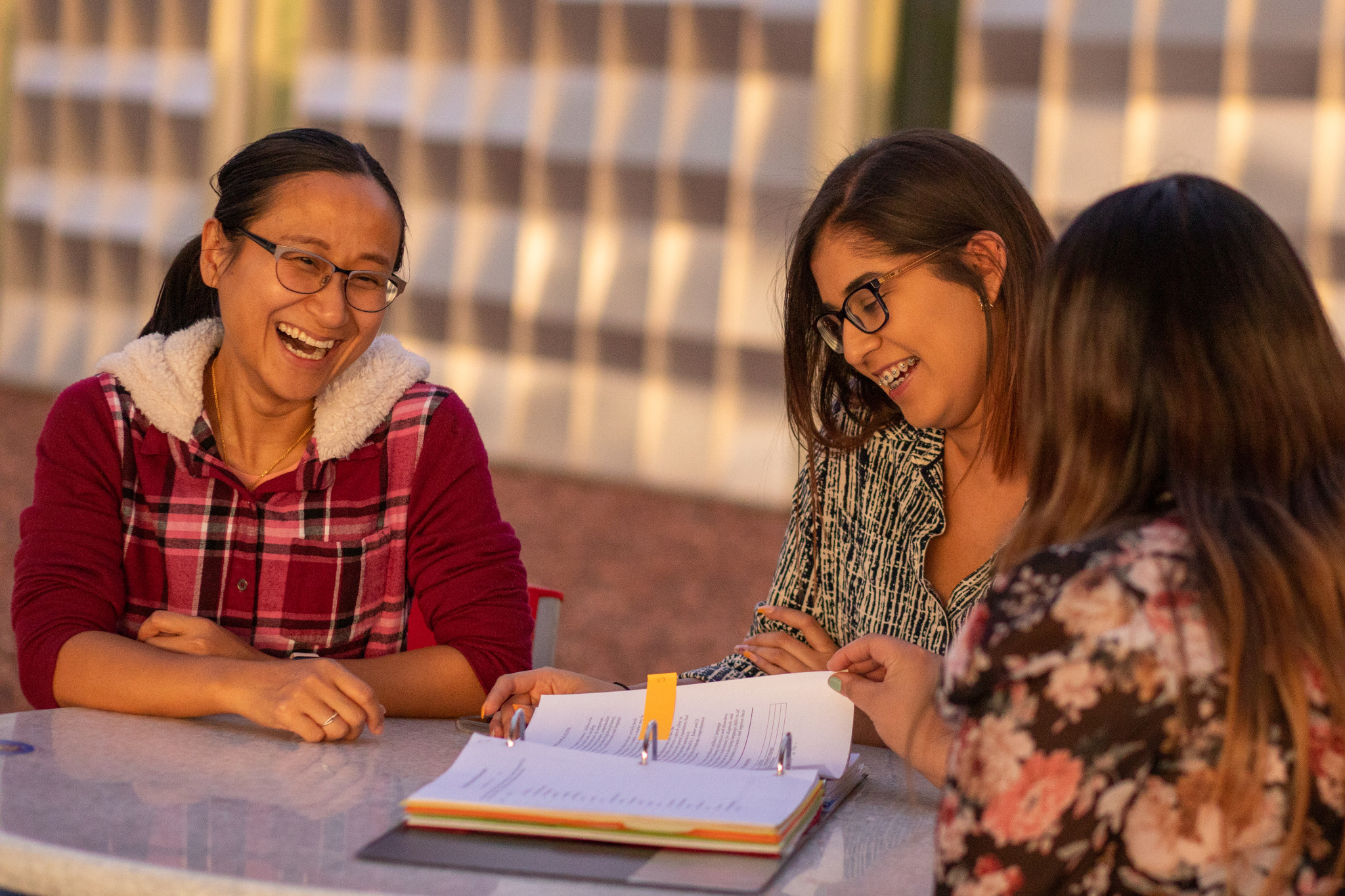 Students working together outside on the N A U–Yuma campus.