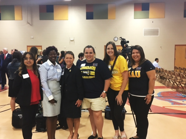 NAU scholarship recipients smiling with former NAU President, Dr. Rita Cheng.
